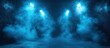 © cusniatul - Abstract blue light with smoke and spotlight effect.