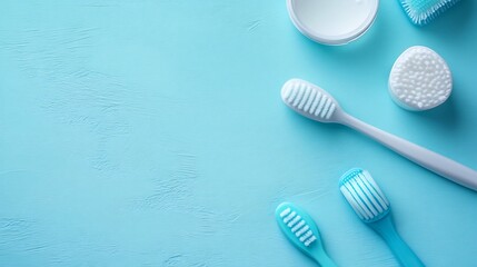 Poster - Flat lay of dental model and professional cleaning tools on a pastel blue surface ideal for dental hygiene promotion banners with clean space for messaging or healthcare branding