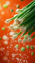 Fototapete - Fresh green spring onions elegantly floating midair surrounded by a burst of vibrant orange background creating a lively and dynamic composition that captures the essence of spring