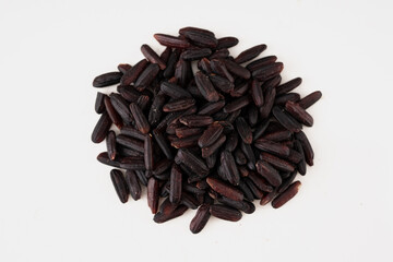 Closeup of Black Rice Grains or Wild Rice in isolated background