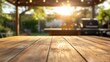© 69 - Close-up of a wooden table with the soft blur of a barbecue in a backyard, perfect for product placements and summer vibes.