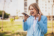© inesbazdar - Image of angry businesswoman screaming on the phone while standing outdoor.