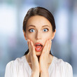 © vgstudio - Wow! Surprised, astonished very happy woman. Girl with wide open eyes, mouth, raise hands. Unbelievable big sale, rebates offer, discounts ad concept image. Isolated blurred office background. Square