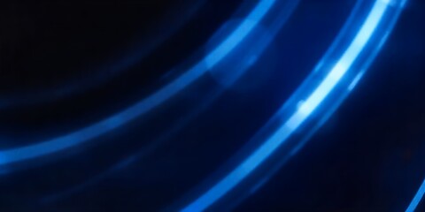 Wall Mural - Abstract blue light streaks on a dark background.