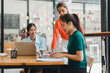 © PRIME STOCK LAB - Collaborative women working together in modern office space, sharing ideas and engaging in productive discussion. Their expressions reflect enthusiasm and teamwork