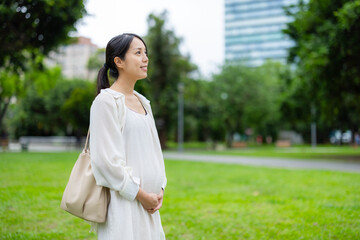 Wall Mural - Pregnant woman in the park