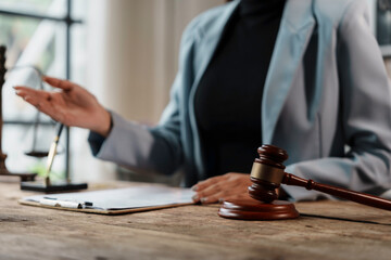 Wall Mural - Lawyer is explaining a contract to her client during a meeting in her law office