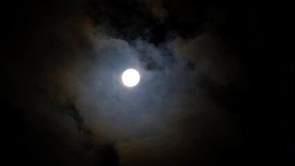 Wall Mural - full moon in the night sky with clouds