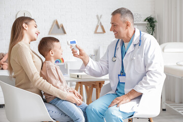 Wall Mural - Little boy with mother at pediatrician's office