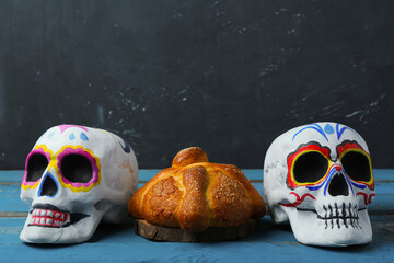 Painted skulls for Mexico's Day of the Dead (El Dia de Muertos) and traditional bread on table