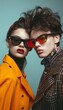© bvbflo1 - Fashion couple young models in stylish sunglasses on a minimalistic wall background. Ideal advertising for accessories eyewear stores.