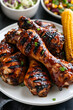 © A2Z AI  - Plate of Grilled Chicken Drumsticks: Deliciously Cooked, Perfect for Summer BBQs and Family Dinners.
