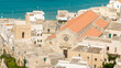 © Stefano Tammaro - Aerial view of the Cathedral of Santa Maria Annunziata located in Otranto, Salento, Puglia, Italy. It is a minor basilica in the historic center of the town. In the background is the Adriatic Sea.