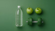 © A2Z AI  - Set of Weight Loss Essentials: Water Bottle, Green Apple, and Dumbbells for Fitness and Healthy Living.