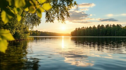 Poster - A serene sunset reflection over a tranquil lake surrounded by lush greenery and gentle clouds, creating a peaceful natural landscape.