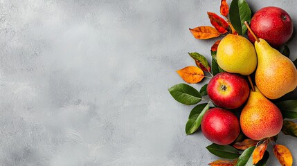 Poster - A colorful arrangement of apples and pears with autumn leaves, set against a textured gray background, perfect for seasonal decor or food-related themes.