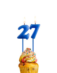 Candle in shape of the number 27 - Blue birthday on a white background.