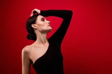 Photo of stunning chic lady touch her hairstyle look profile side posing isolated red background