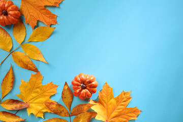 Wall Mural - Autumn composition. Frame made of fall leaves and pumpkins. Flat lay, top view, copy space