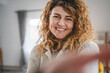 © Miljan Živković - Portrait of adult caucasian woman with curly hair at home happy smile