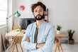 © Xavier Lorenzo - Portrait of successful young creative business man standing at modern workplace. Small business and entrepreneur people concept.