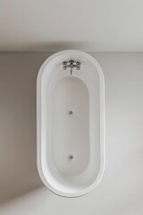 Top view of a white classic style bathtub with stainless steel faucet. Isolated on a white background