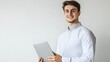 © sungedi - Smiling Young Man Holding a Tablet Against a White Background