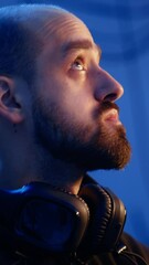 Poster - vertical video hacker hiding in underground bunker, looking over his shoulder and feeling anxious af
