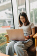 © Sevendeman - Asian woman focus on working her job online, in the public coffee cafe.
