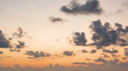 Wall Mural - time lapse of dramatic sunrise with orange sky in a cloudy day.