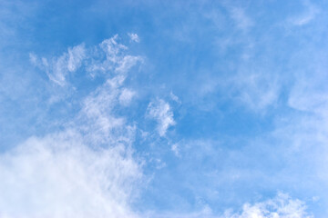 Wall Mural - beautiful blue sky and white fluffy group of clouds with sunrise in the morning, natural background