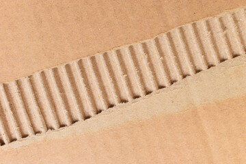 Wall Mural - tear brown cardboard box texture background, recycle material