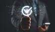 © Nirusmee - Businessman hand thumb up with virtual correct sign or tick mark for approve quality assurance and guarantee concept.