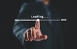 © Nirusmee - Businessman touching to downloading bar to change 2024 to 2025 year for change and preparation new business year concept.