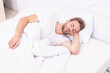 © be free - Asleep young man sleeping. Resting peacefully in comfortable bed. Lying with closed eyes. Deep male sleep. Man sleeping at night. Sleepy man lying on bed sleeping at white bedroom. Peaceful bedtime