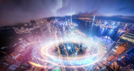 Canvas Print - Aerial night view of a city in Hong Kong, China with glowing lights from skyscrapers and streets.