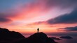 © Riya - Silhouette of person standing on mountain peak at sunset