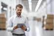 © kitipol - Manager working with tablet in sleek warehouse, store , supply chain