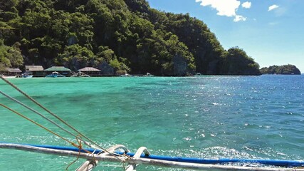 Wall Mural - tropical philippines island, view from moving boat. white sand beach, rocks cliffs mountains and blu