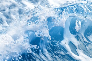 Poster - A vibrant image of a foamy ocean wave captured in bright blue and white, indicating the energy and movement of the ocean, with intricate details.