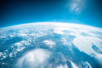 Poster - A breathtaking view of the cloud-covered Earth from space, showing the expansive blue atmosphere and curvature, highlighting our planet's majestic beauty.