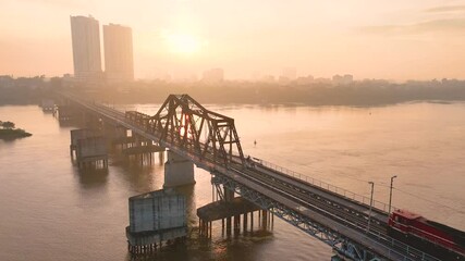 Wall Mural - Aerial view of Long Bien bridge over Hong river (or Red river) that connects two districts, Hoan Kiem and Long Bien in Hanoi city, Vietnam.