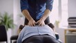 © aubriella - A chiropractor performing a spinal alignment adjustment on a patient in a treatment room, with chiropractic tools and supportive pillows visible, Therapeutic style
