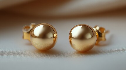 Poster - Minimalist gold studs a smooth polished finish placed on a neutral minimalistic backdrop showcasing their sleek modern design