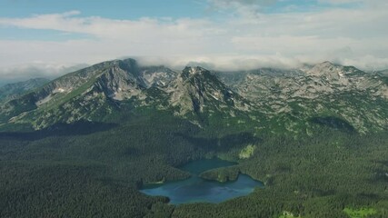 Wall Mural - aerial view of famous black lake in mountain durmitor park at summer, montenegro, 4k