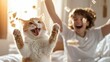 © Maximages  - A cheerful cat leaps with excitement as sunlight bathes the room, with a young person in the background celebrating with playful energy and laughter.