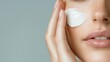 © Maximages  - A person's hand applying a creamy moisturizer on smooth facial skin, emphasizing skincare routine and the pursuit of soft, healthy, and hydrated complexion.