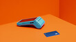 © Jacob Lund - Cashless payment concept with card machine and credit card on orange background