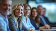 © mertingen - Smiling businesspeople attending a meeting