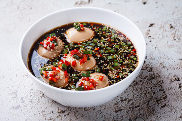 Canvas Print - Korean marinated eggs in soy sauce with sesame and onions.